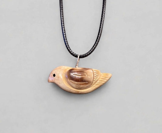 Fossilized Ivory Songbird Pendant by Kateri Quandelacy Sanchez