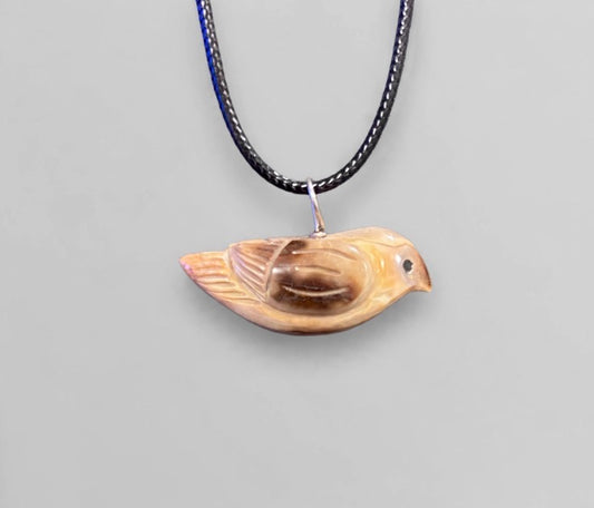 Fossilized Ivory Songbird Pendant by Kateri Quandelacy Sanchez